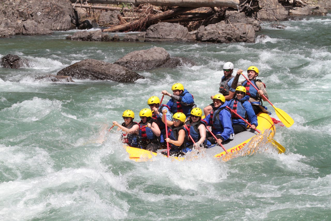 services-02 Group enjoying an exhilarating whitewater rafting adventure in Montanas rapids.